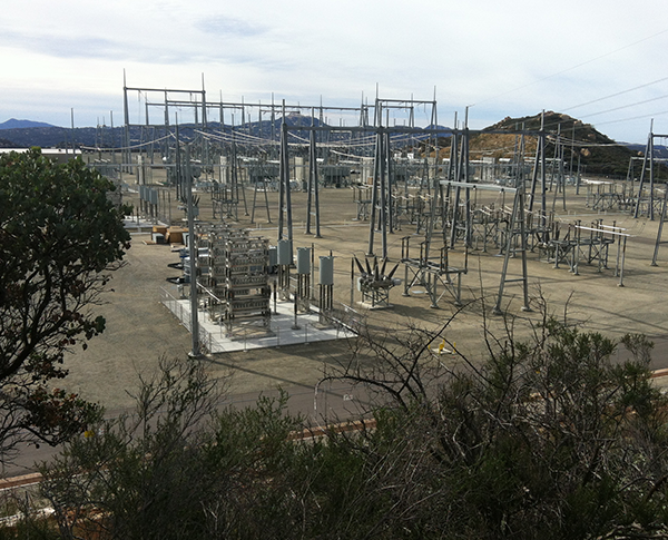 Transmission lines running across vast dry lands